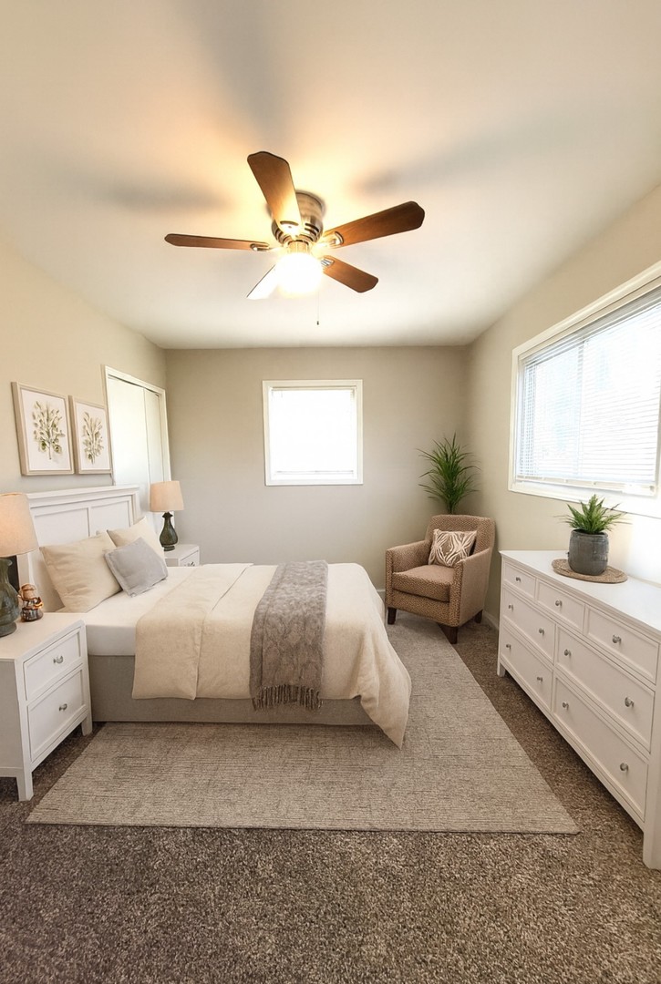 111 East 13th Street Lombard, IL 60148 - Photo 17 of 24 a spacious bedroom with a bed and window