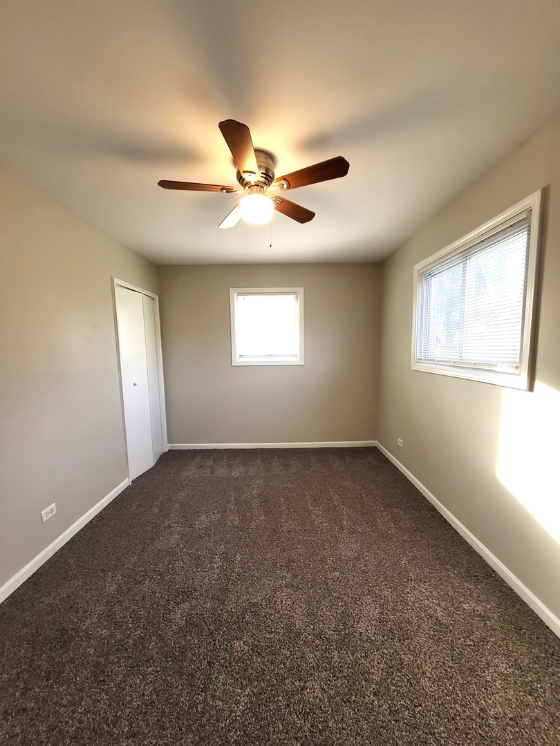 111 East 13th Street Lombard, IL 60148 - Photo 18 of 24 a view of an empty room with a window