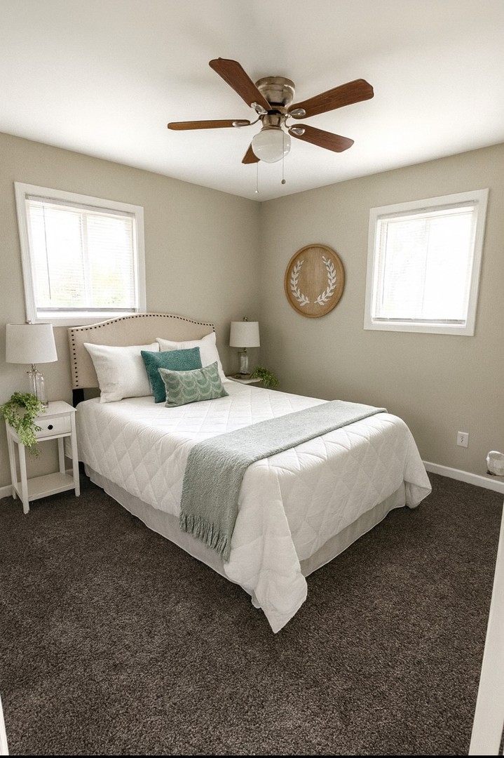 111 East 13th Street Lombard, IL 60148 - Photo 19 of 24 a bedroom with a bed and a window