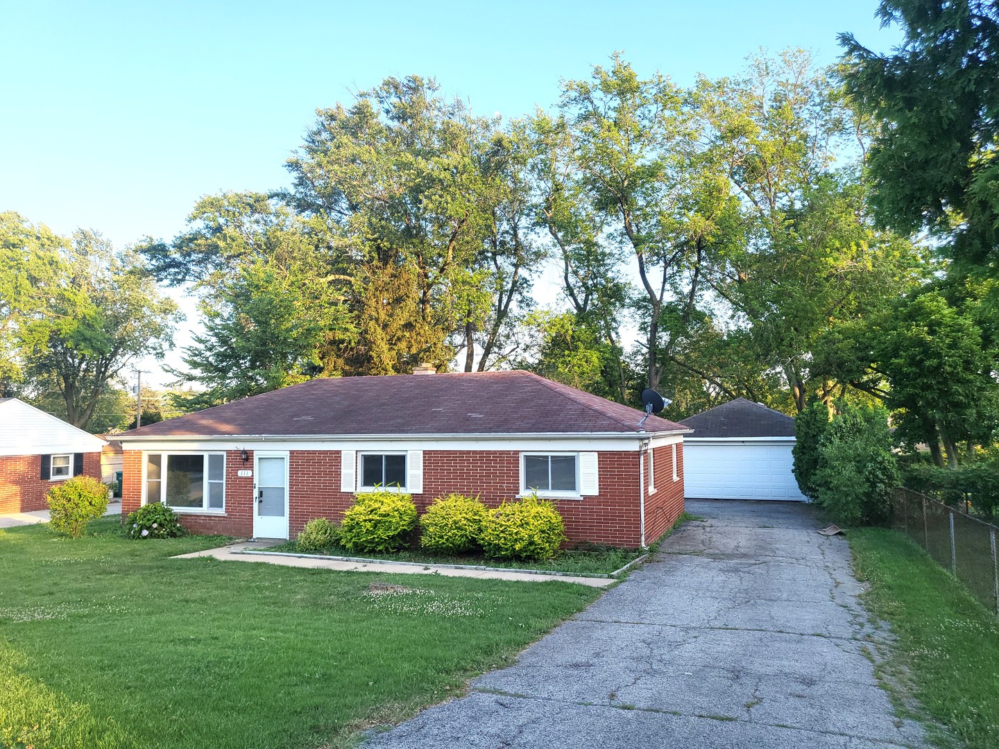 111 East 13th Street Lombard, IL 60148 - Photo 2 of 24 a front view of a house with a garden