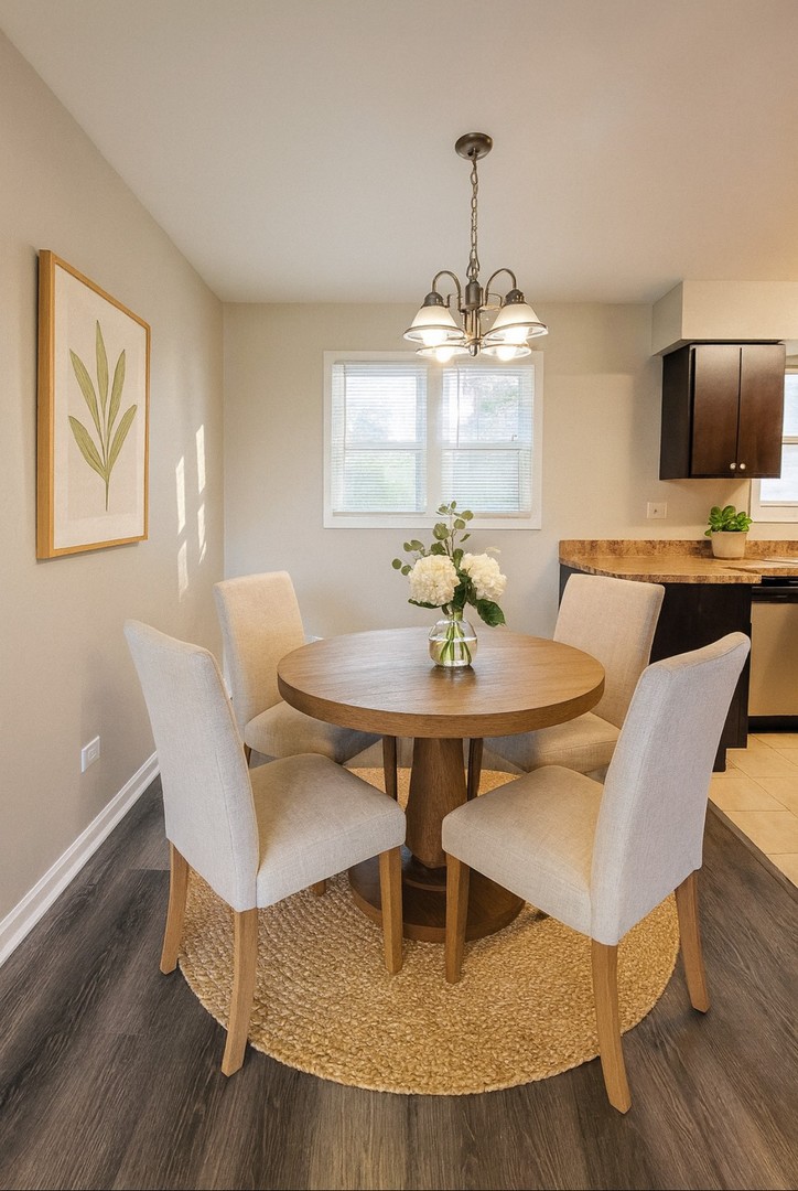 111 East 13th Street Lombard, IL 60148 - Photo 5 of 24 a view of a dining room with furniture wooden floor and chandelier