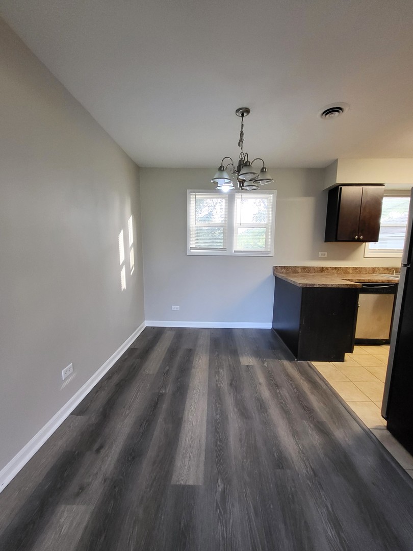 111 East 13th Street Lombard, IL 60148 - Photo 6 of 24 a view of a livingroom with a window
