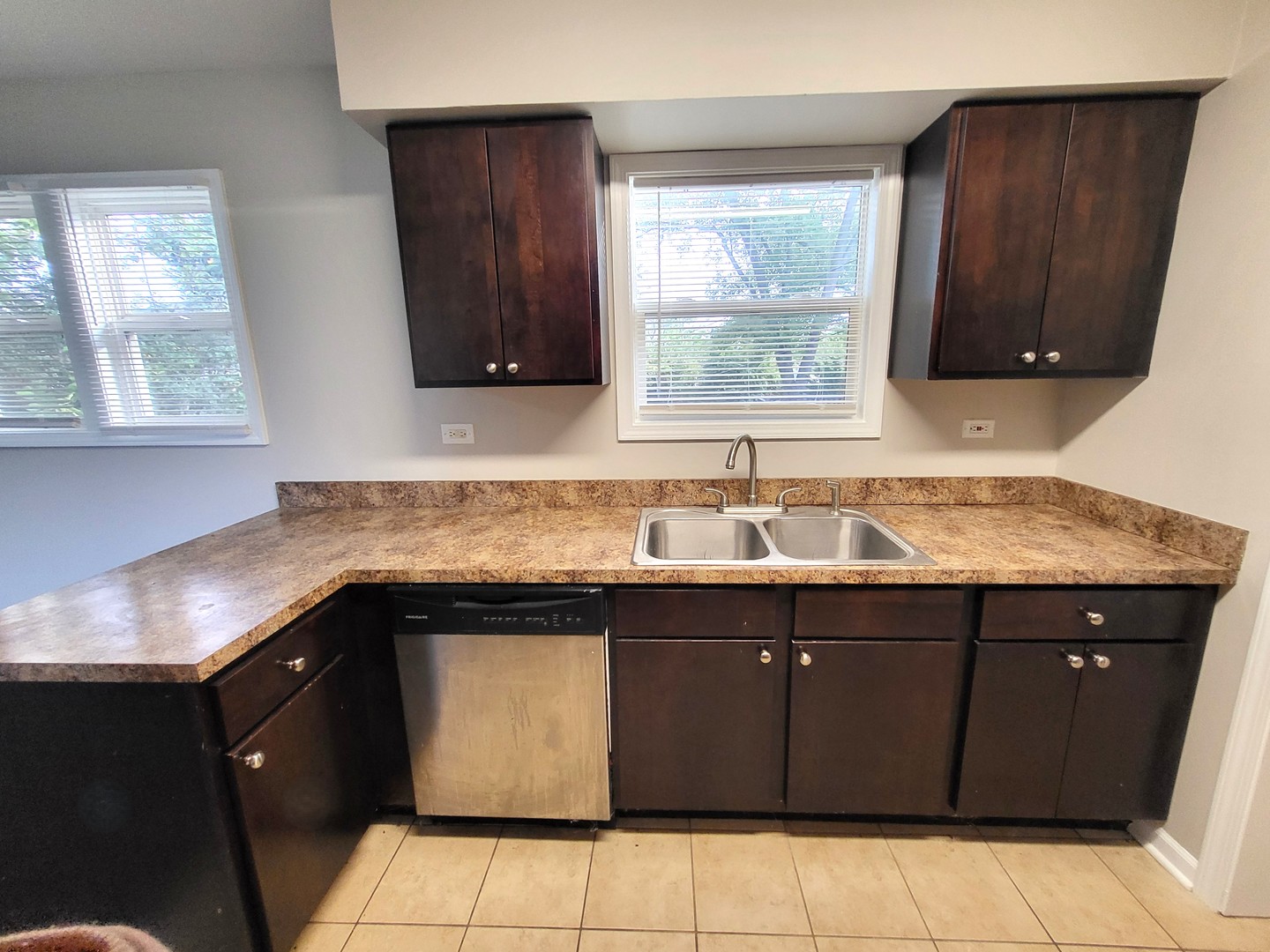 111 East 13th Street Lombard, IL 60148 - Photo 9 of 24 a kitchen with a sink and a window