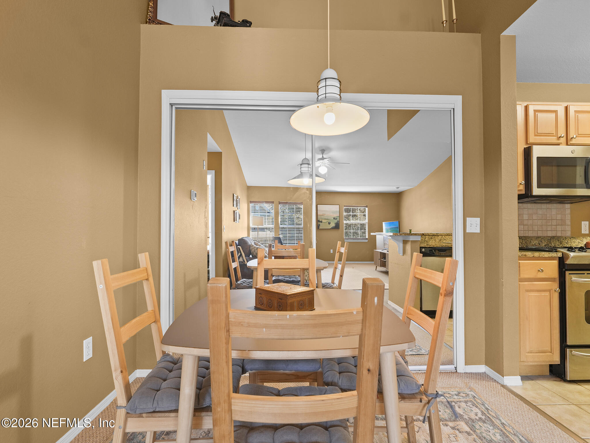 712 Lighthouse Road, Unit 712 Panama City Beach, FL 32407 - Photo 11 of 42 a view of a dining room with furniture