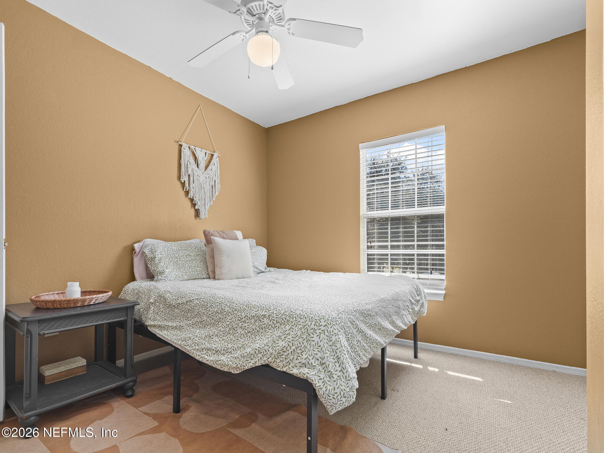712 Lighthouse Road, Unit 712 Panama City Beach, FL 32407 - Photo 18 of 42 a bedroom with a bed and a table