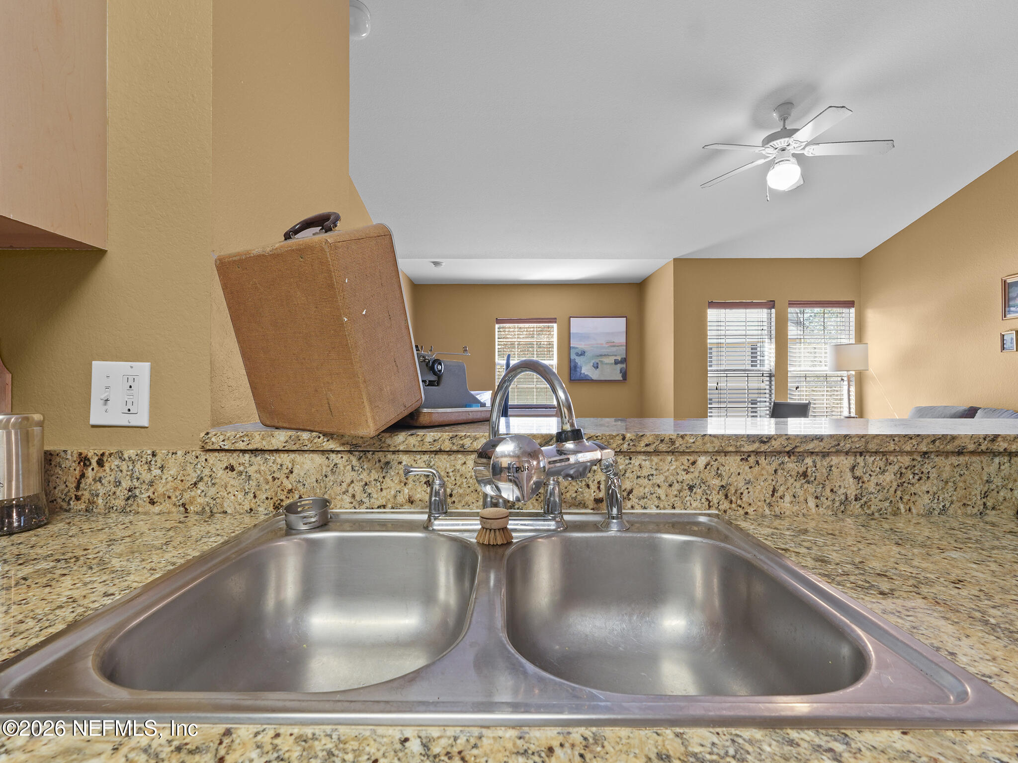 712 Lighthouse Road, Unit 712 Panama City Beach, FL 32407 - Photo 22 of 42 a bathroom with a sink a mirror and window