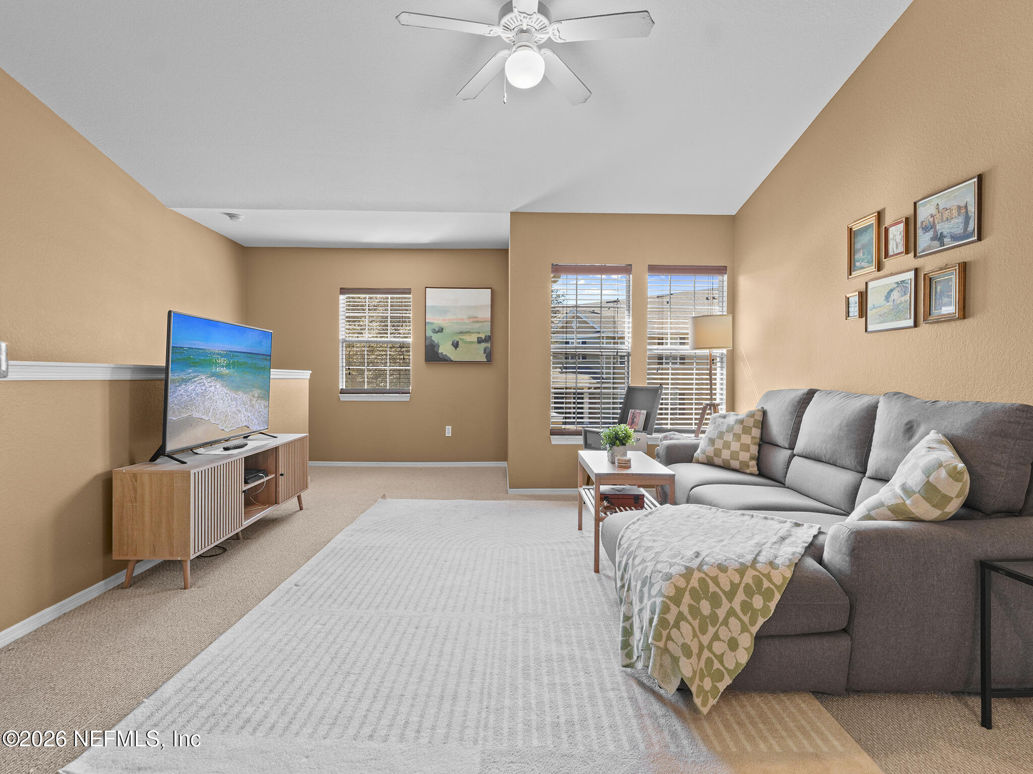 712 Lighthouse Road, Unit 712 Panama City Beach, FL 32407 - Photo 25 of 42 a living room with furniture and a flat screen tv