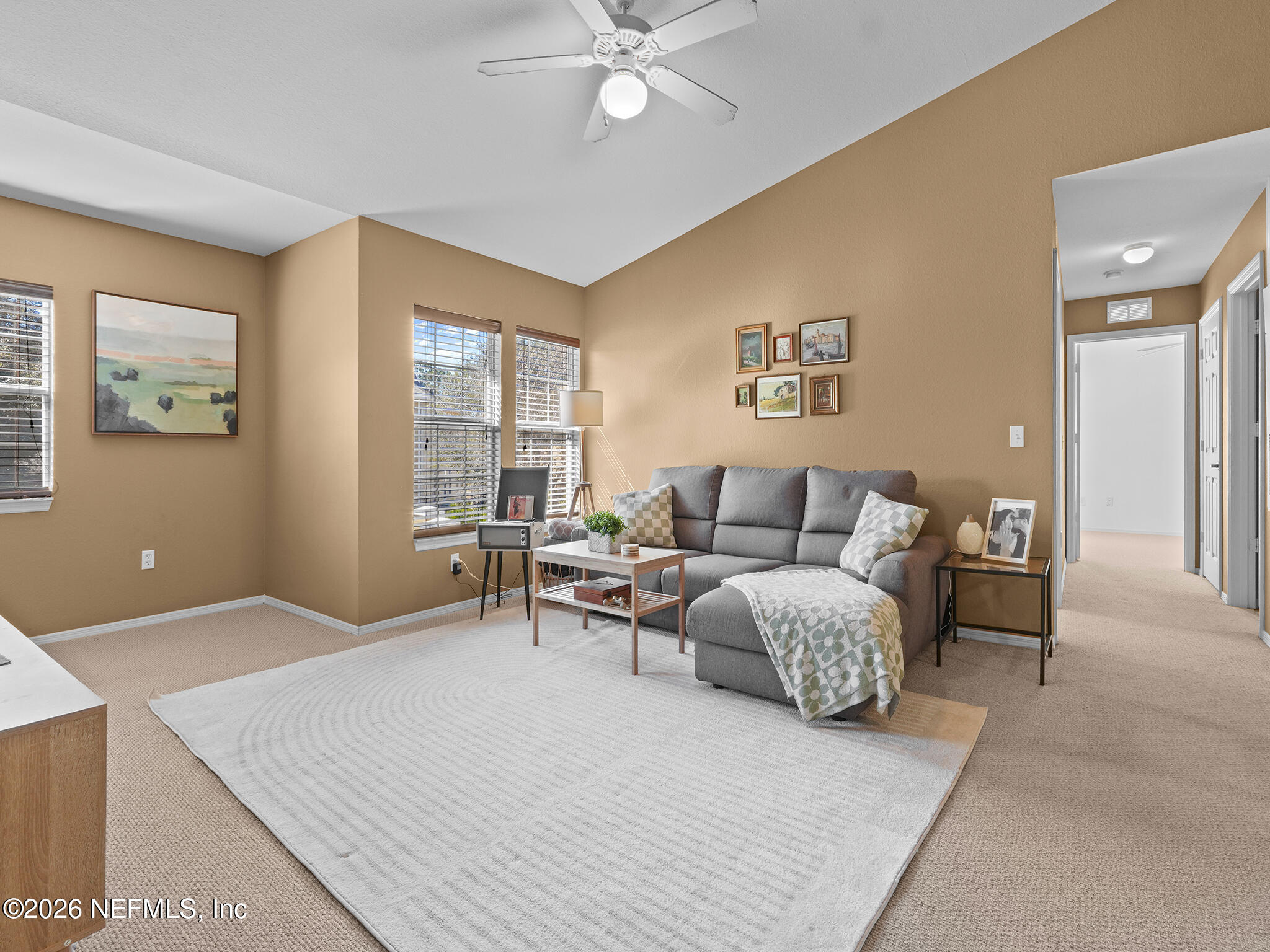 712 Lighthouse Road, Unit 712 Panama City Beach, FL 32407 - Photo 26 of 42 a living room with furniture and a large window