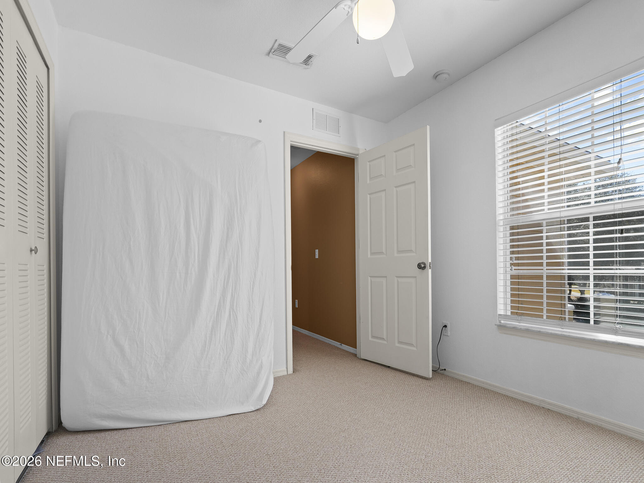 712 Lighthouse Road, Unit 712 Panama City Beach, FL 32407 - Photo 31 of 42 a view of an empty room with a window
