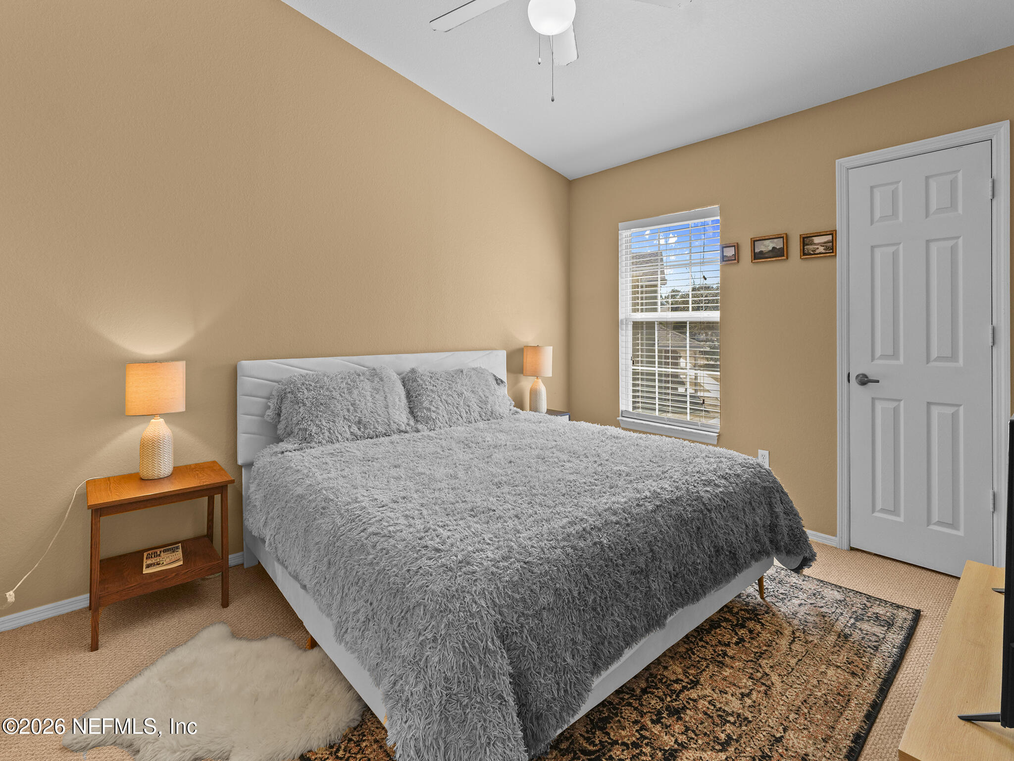 712 Lighthouse Road, Unit 712 Panama City Beach, FL 32407 - Photo 34 of 42 a bedroom with a bed and a window