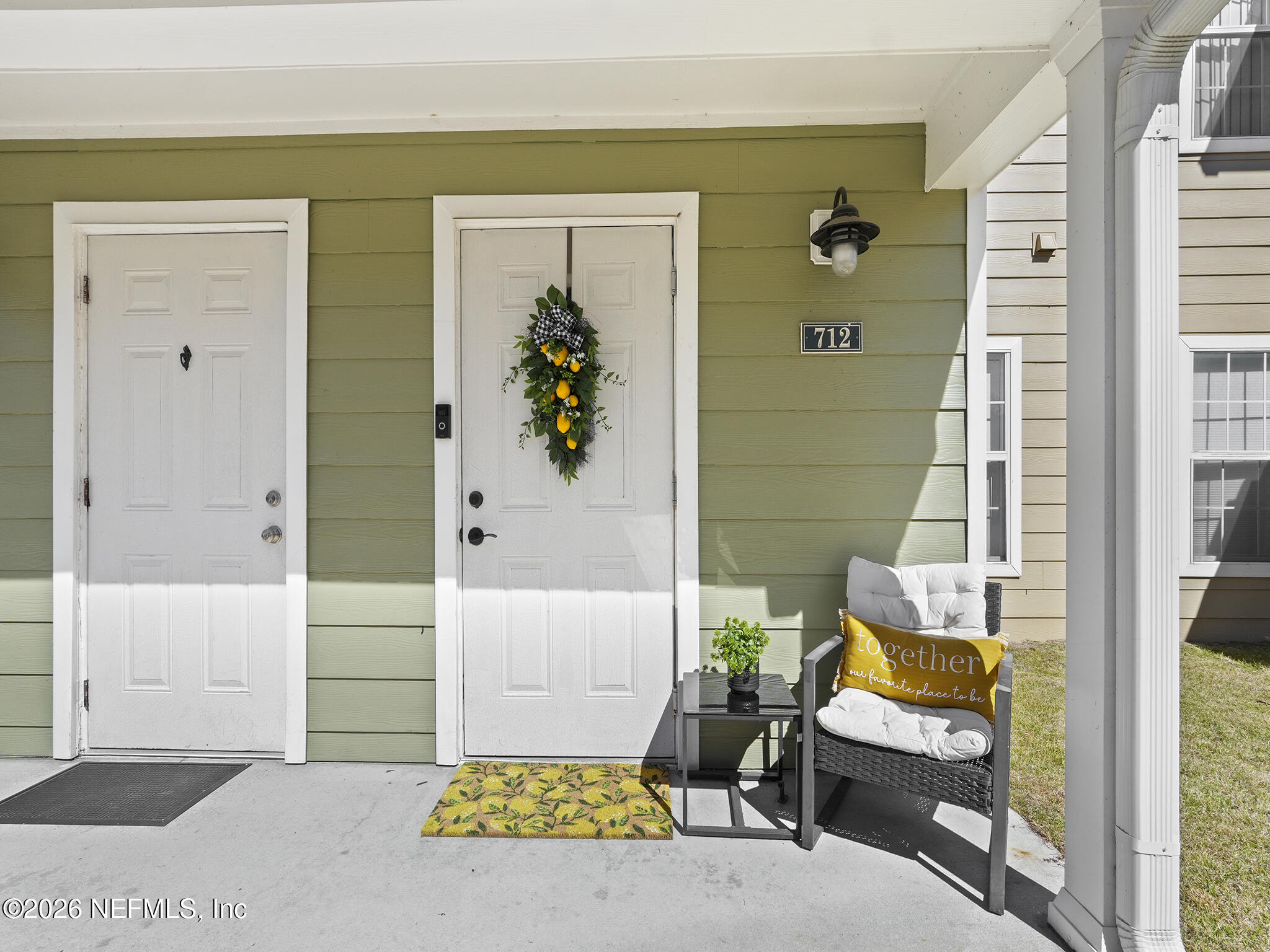 712 Lighthouse Road, Unit 712 Panama City Beach, FL 32407 - Photo 4 of 42 a view of an entryway with wooden floor and a livingroom view