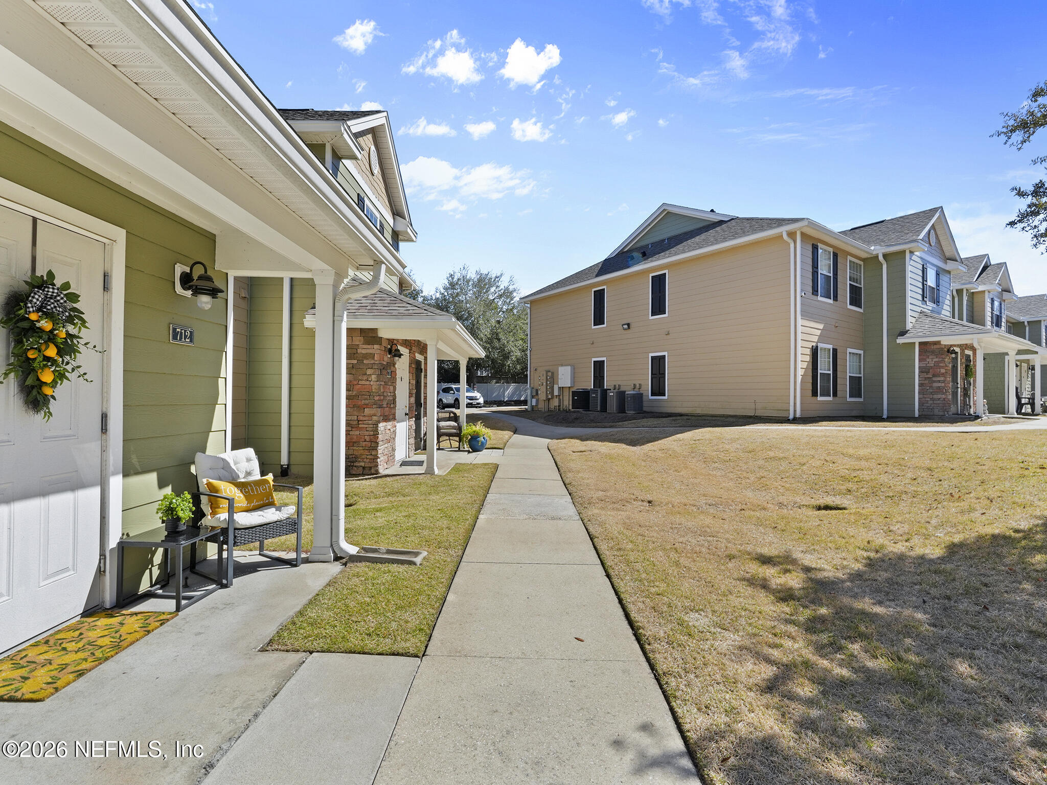712 Lighthouse Road, Unit 712 Panama City Beach, FL 32407 - Photo 5 of 42 a view of swimming pool with a lounge chairs in patio
