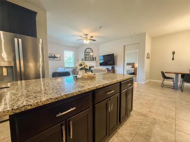 a kitchen with sink stove and cabinets