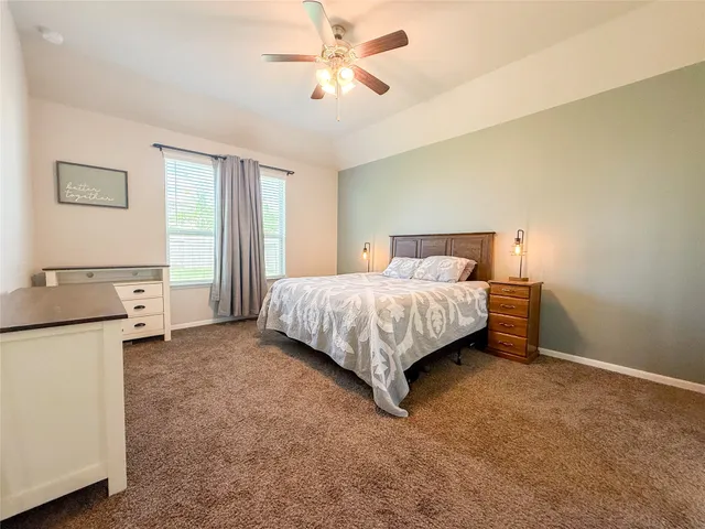 a spacious bathroom with a double vanity sink a mirror and a shower