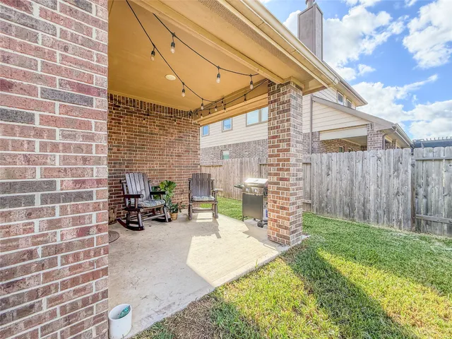 a view of a backyard with a garden and plants