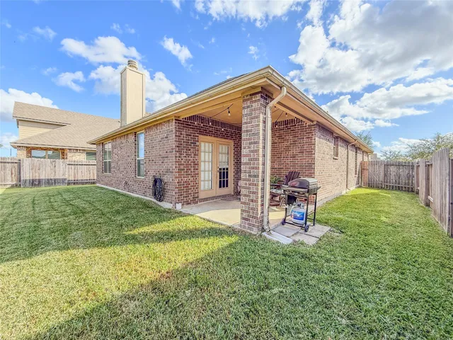a view of a sign board with yard