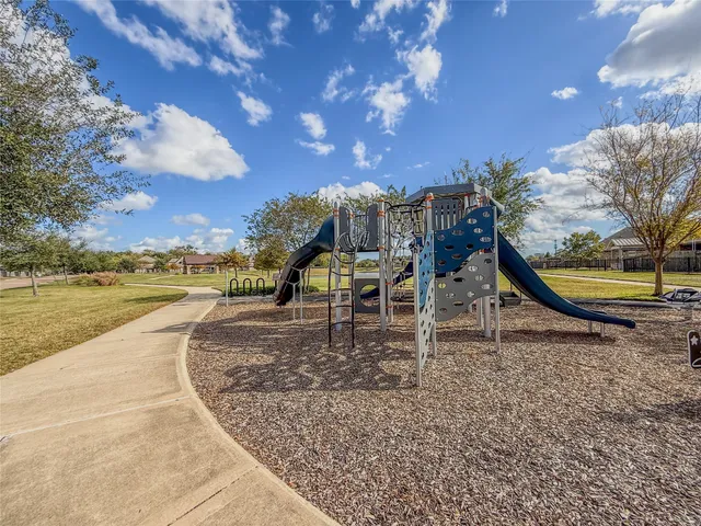 a view of swimming pool with outdoor seating
