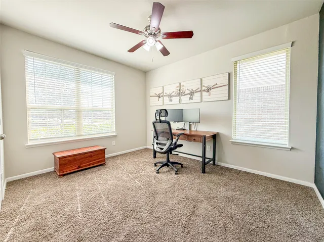 a bedroom with furniture and a book shelf