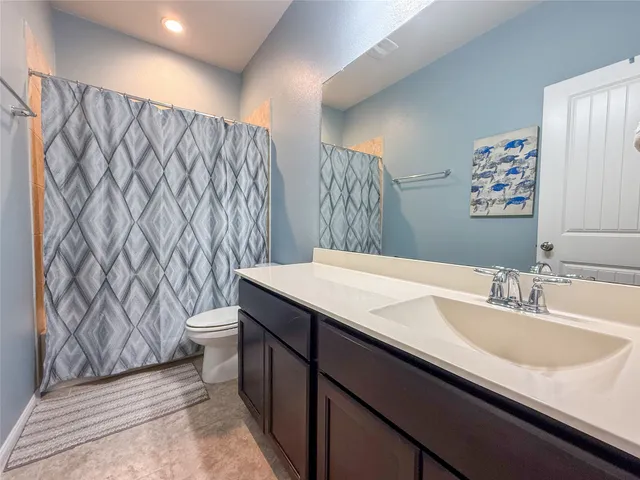 a view of a livingroom with furniture and a dining table