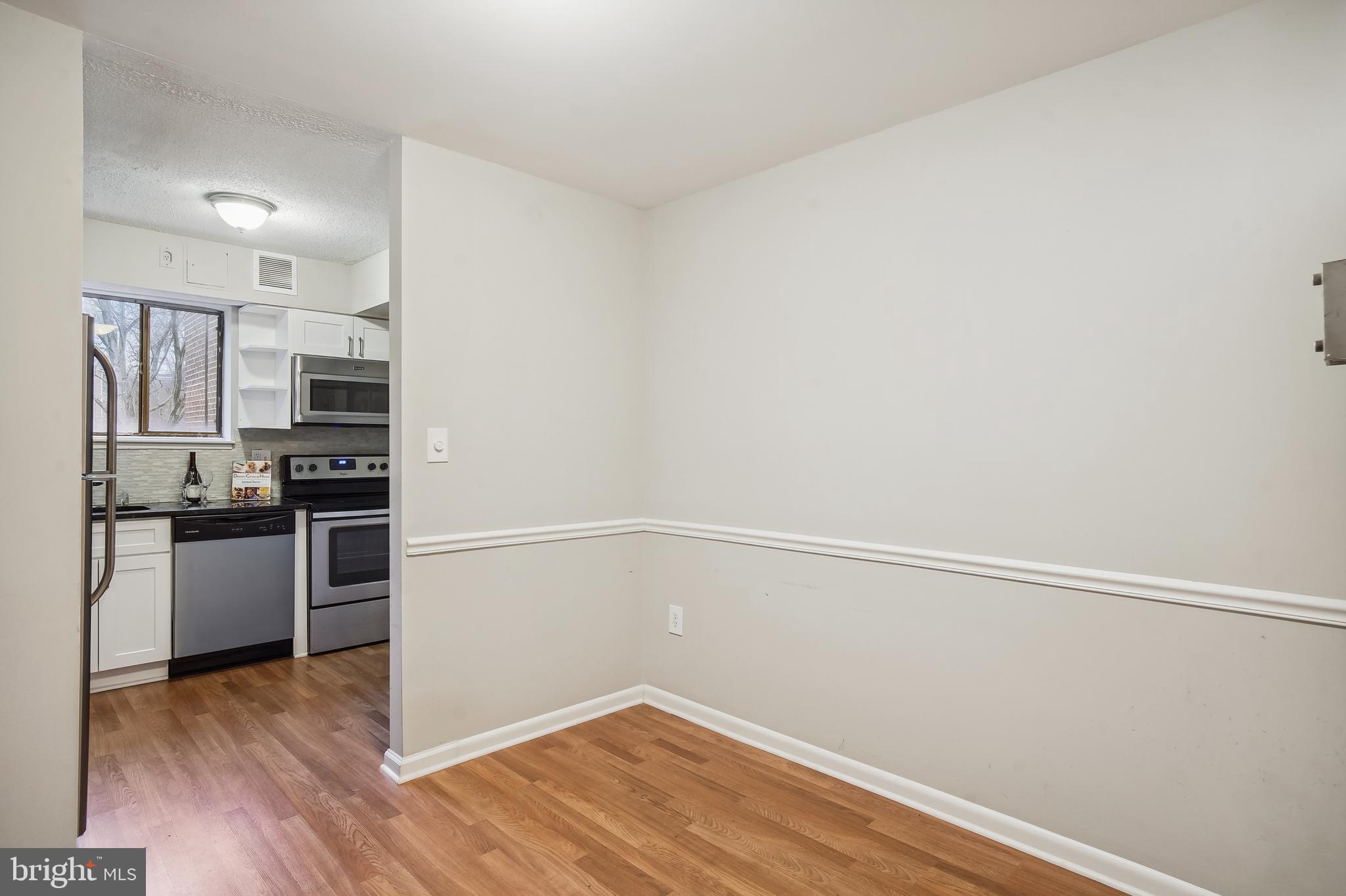 17817 Buehler Road, Unit 96 Olney, MD 20832 - Photo 14 of 38 a kitchen with a refrigerator and a stove top oven