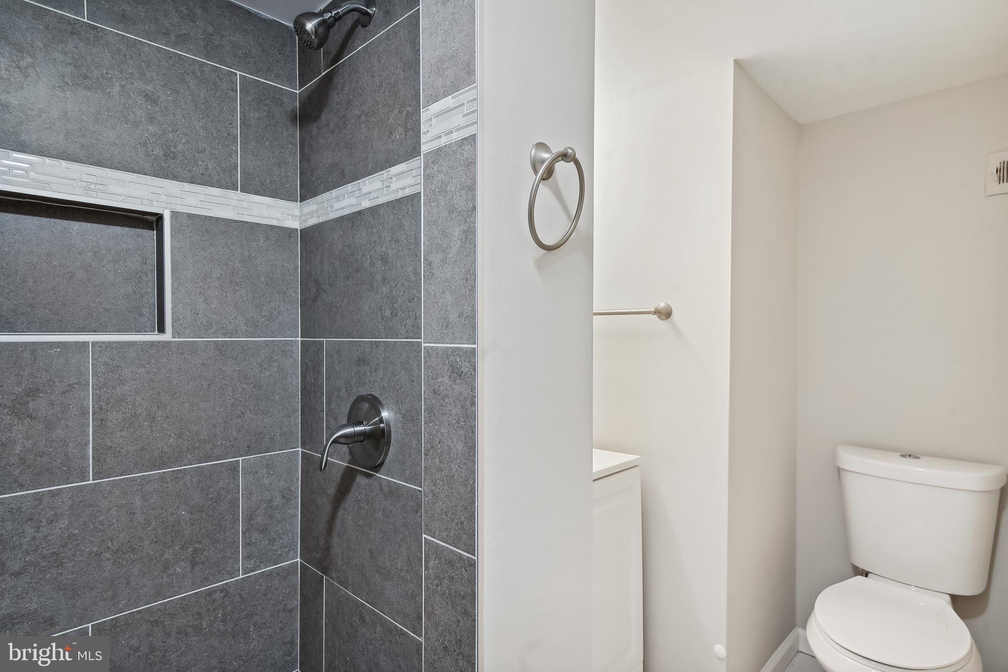 17817 Buehler Road, Unit 96 Olney, MD 20832 - Photo 16 of 38 a bathroom with a toilet and a shower