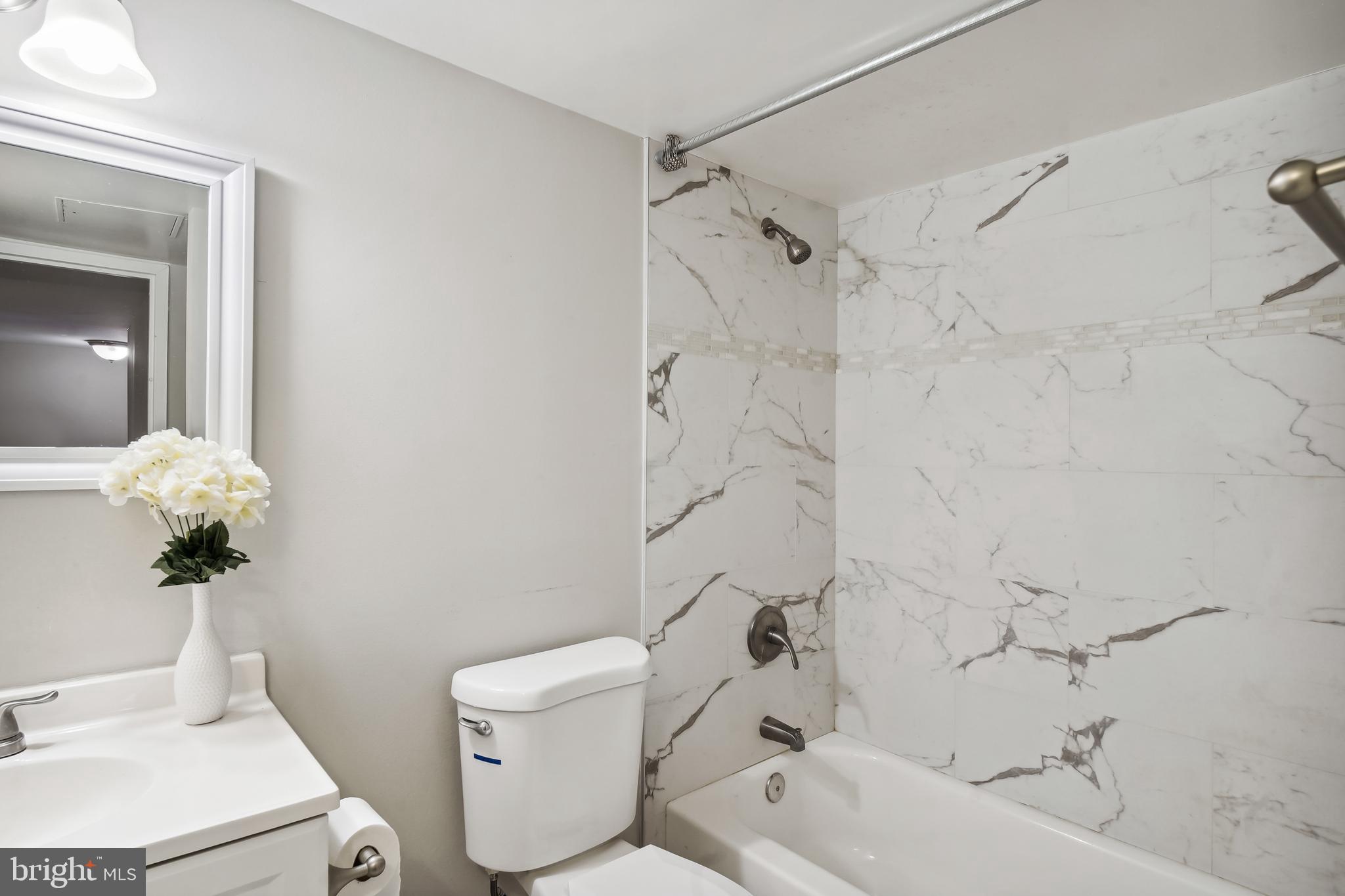 17817 Buehler Road, Unit 96 Olney, MD 20832 - Photo 19 of 38 a bathroom with a sink toilet and shower