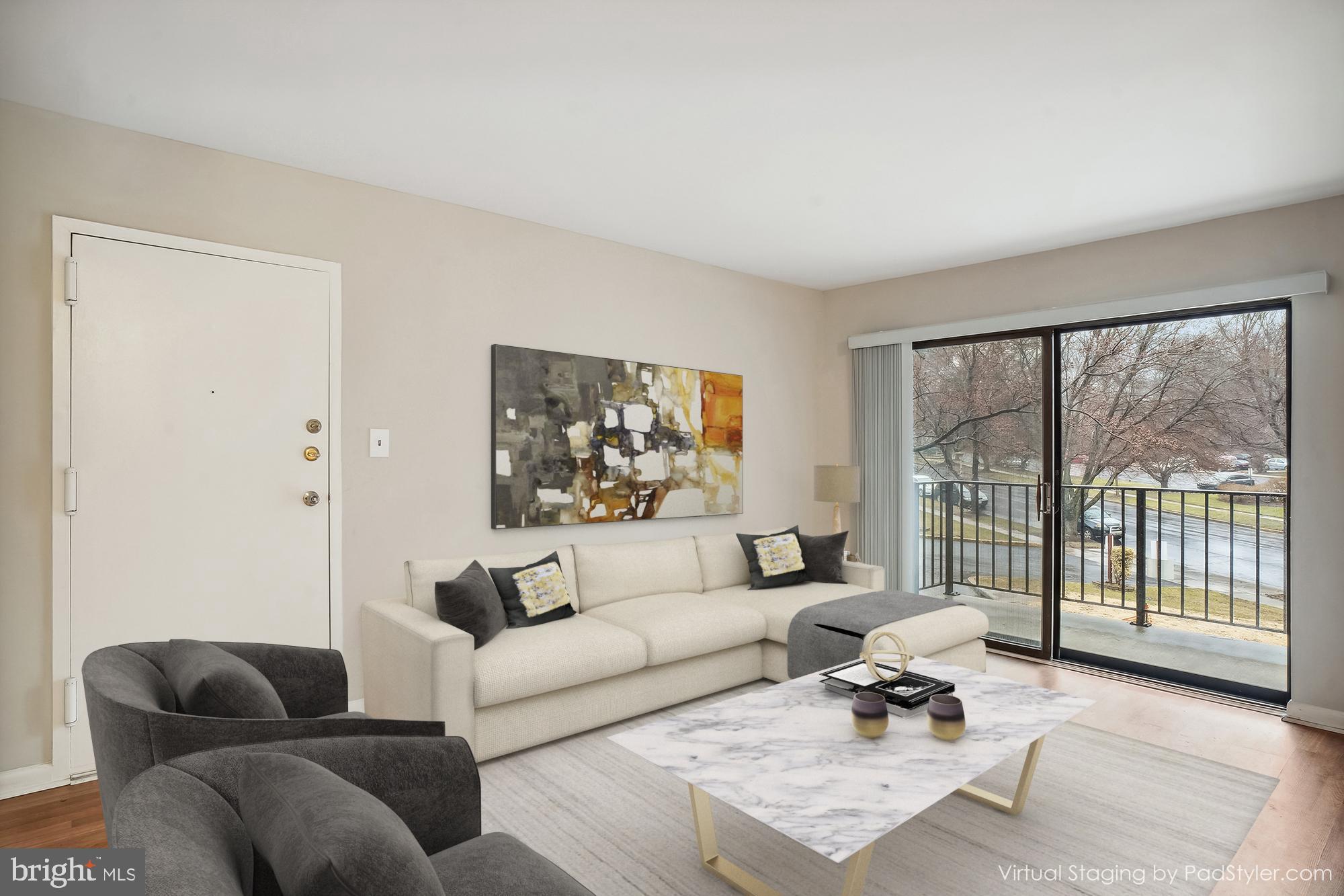 17817 Buehler Road, Unit 96 Olney, MD 20832 - Photo 2 of 38 a living room with furniture and a large window