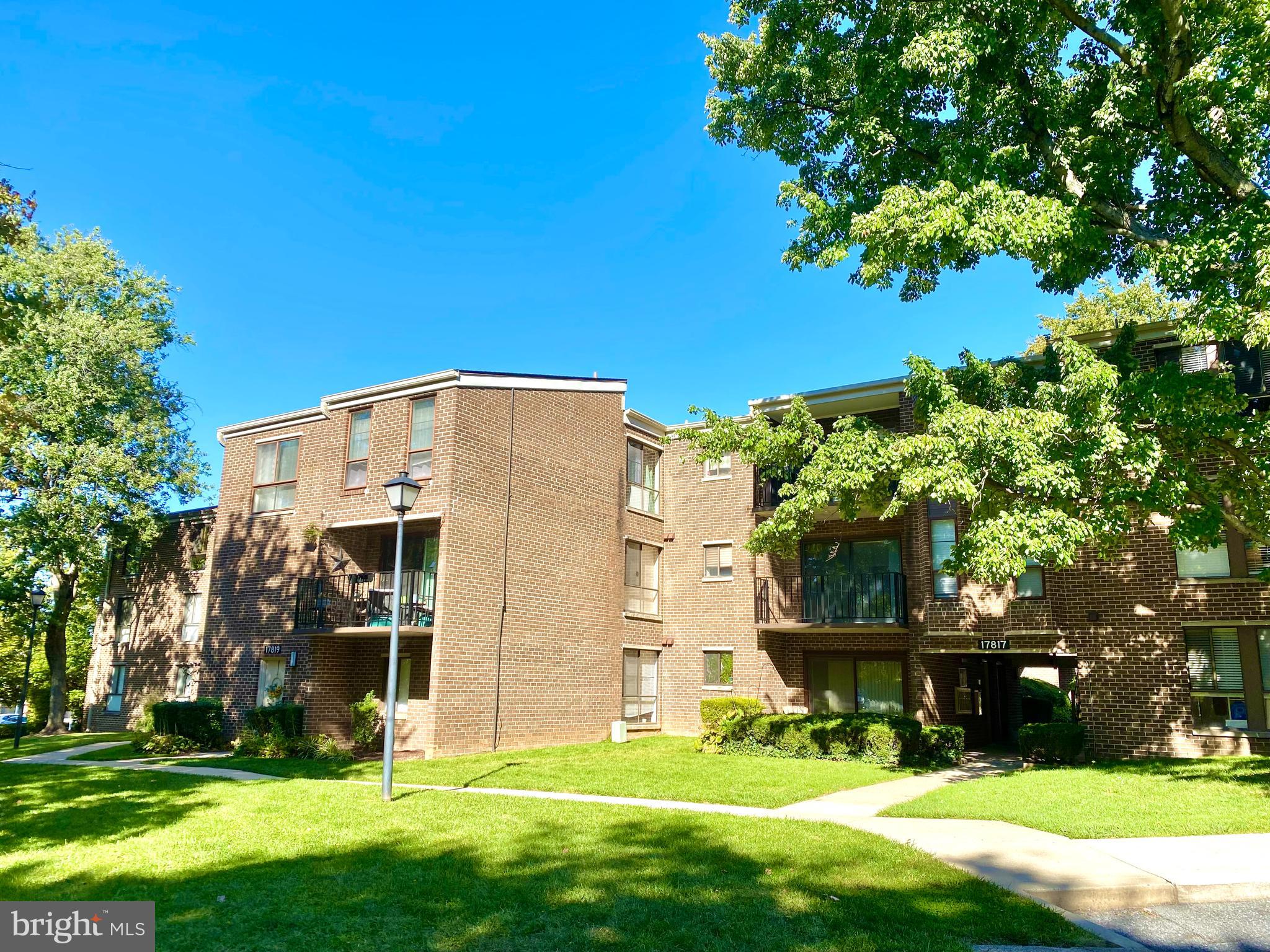 17817 Buehler Road, Unit 96 Olney, MD 20832 - Photo 24 of 38 a view of a white house with a big yard and potted plants
