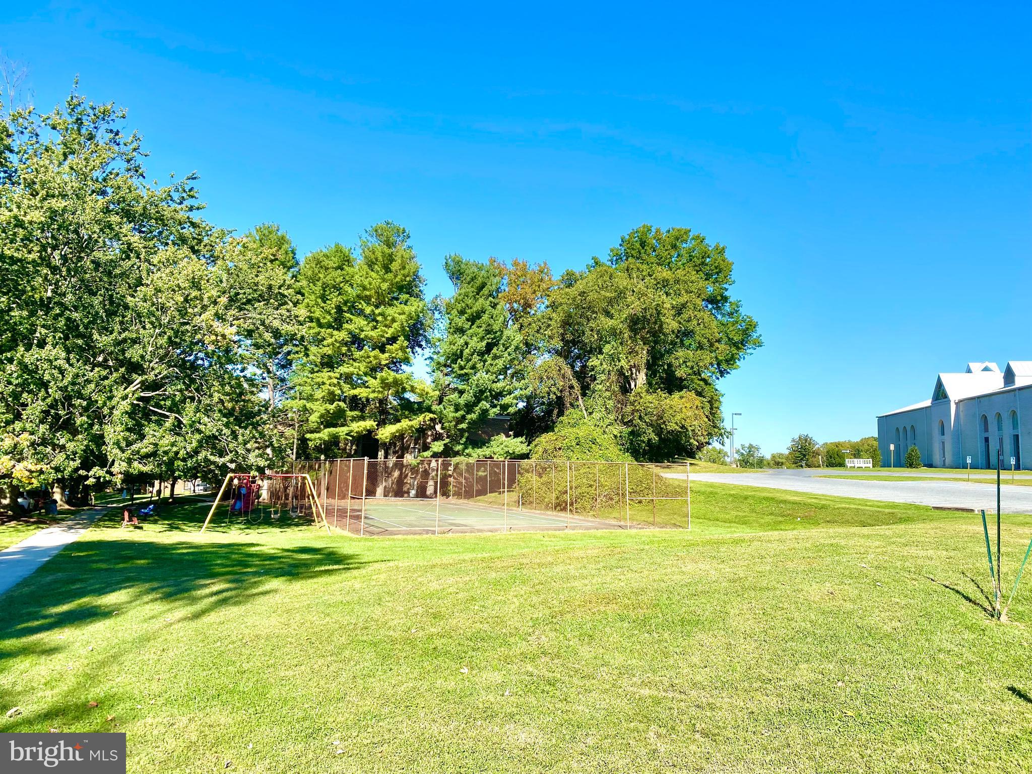 17817 Buehler Road, Unit 96 Olney, MD 20832 - Photo 25 of 38 a view of a swimming pool with a yard