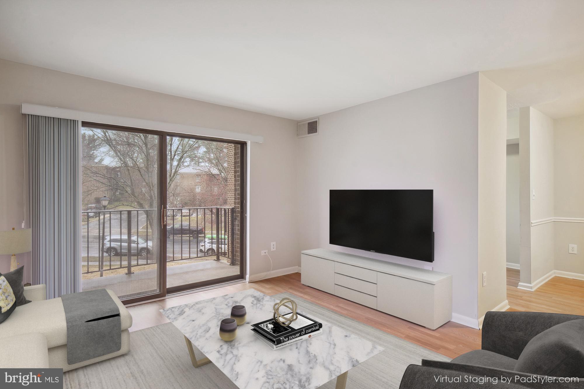 17817 Buehler Road, Unit 96 Olney, MD 20832 - Photo 4 of 38 a living room with furniture and a flat screen tv