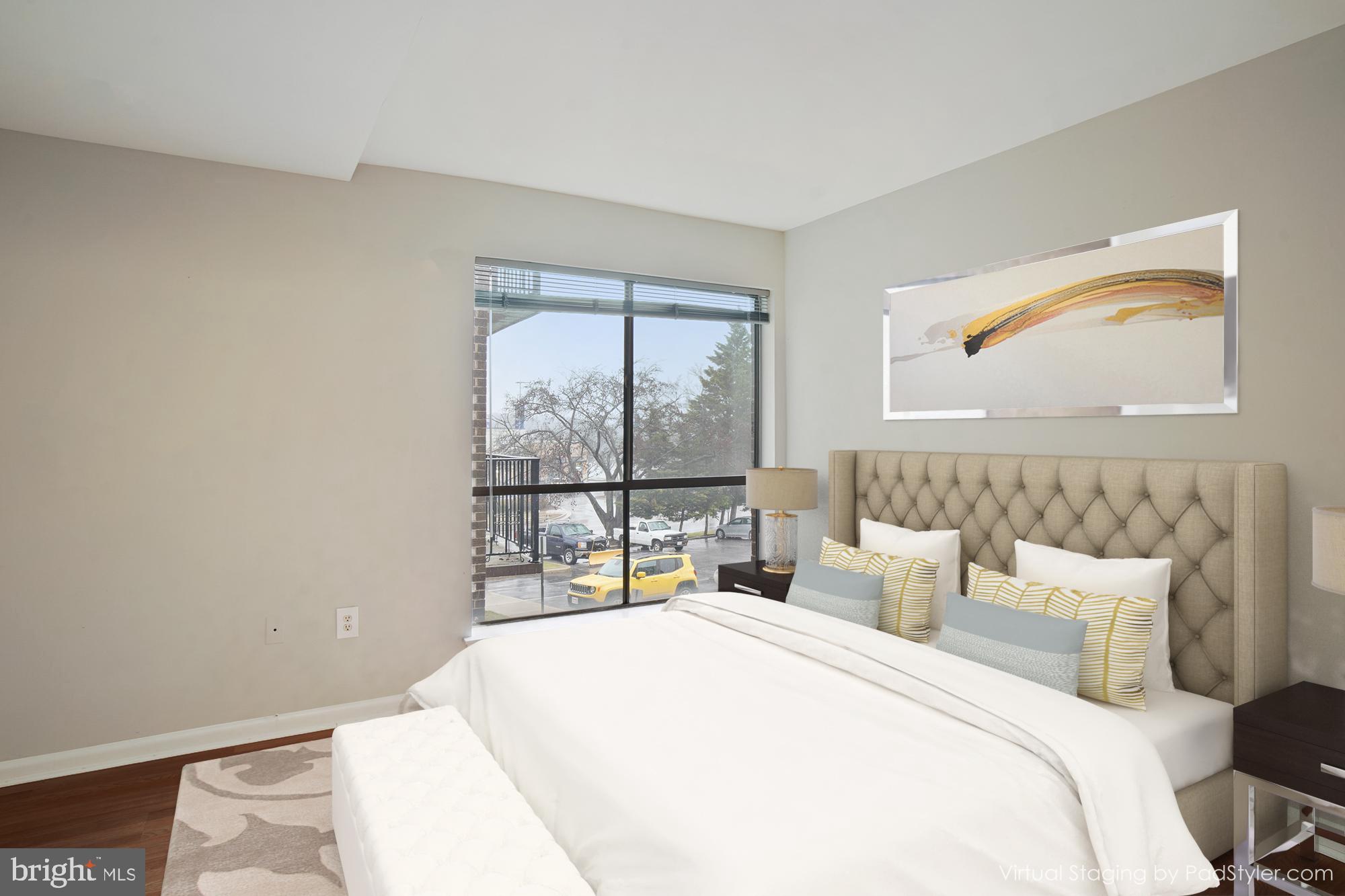 17817 Buehler Road, Unit 96 Olney, MD 20832 - Photo 6 of 38 a bedroom with a bed and a large window