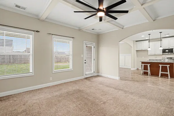 a bedroom with a large bed and a fireplace