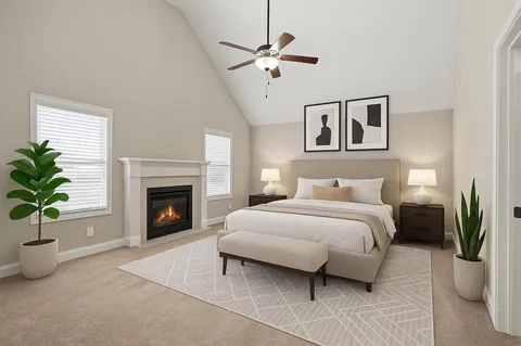 a bedroom with a large bed and a fireplace