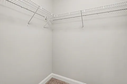 a view of a room with racks on the wall