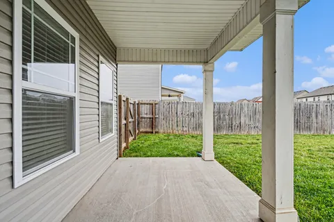 a view of a porch with a backyard