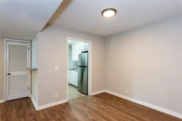 a view of a kitchen cabinets and wooden floor