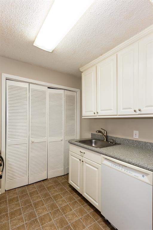 591 Emory Oaks Way, Unit 591 Decatur, GA 30033 - Photo 20 of 33 a kitchen with a sink cabinets and utility