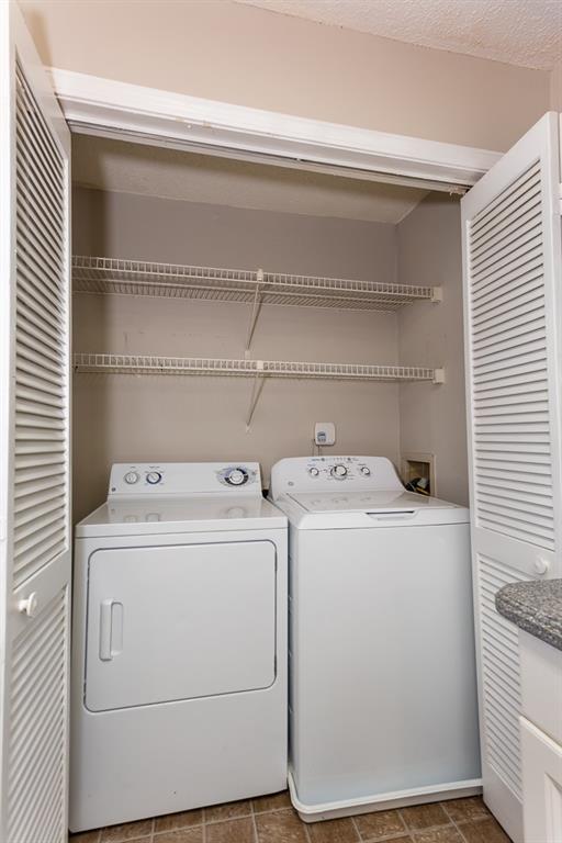 591 Emory Oaks Way, Unit 591 Decatur, GA 30033 - Photo 24 of 33 a utility room with dryer and washer