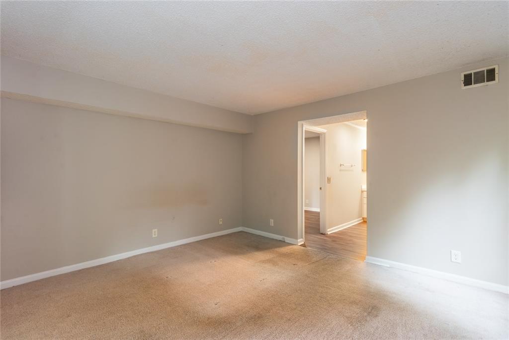 591 Emory Oaks Way, Unit 591 Decatur, GA 30033 - Photo 27 of 33 a view of an empty room