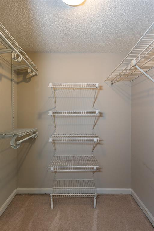 591 Emory Oaks Way, Unit 591 Decatur, GA 30033 - Photo 31 of 33 a view of a room with racks on the wall