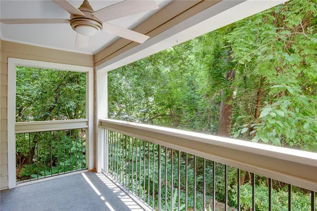 a view of empty room with wooden floor and cabinet