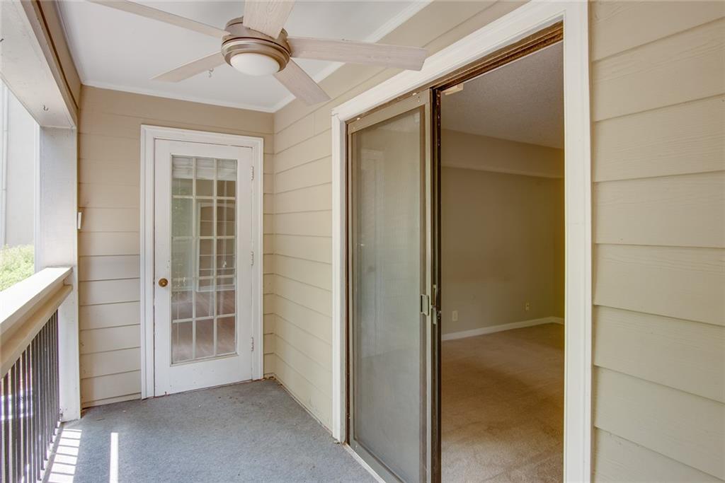 591 Emory Oaks Way, Unit 591 Decatur, GA 30033 - Photo 33 of 33 a view of empty room with wooden floor and cabinet