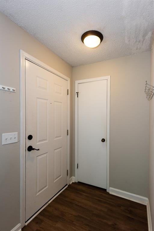 591 Emory Oaks Way, Unit 591 Decatur, GA 30033 - Photo 4 of 33 an empty room with wooden floor and closet