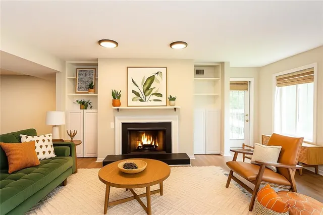 a kitchen with stainless steel appliances granite countertop a sink a stove and a microwave