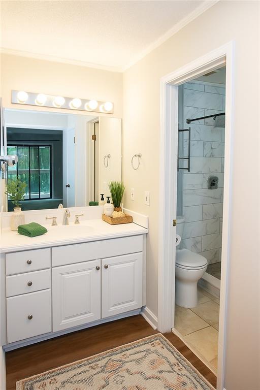 591 Emory Oaks Way, Unit 591 Decatur, GA 30033 - Photo 8 of 33 a bathroom with a granite countertop sink toilet and shower