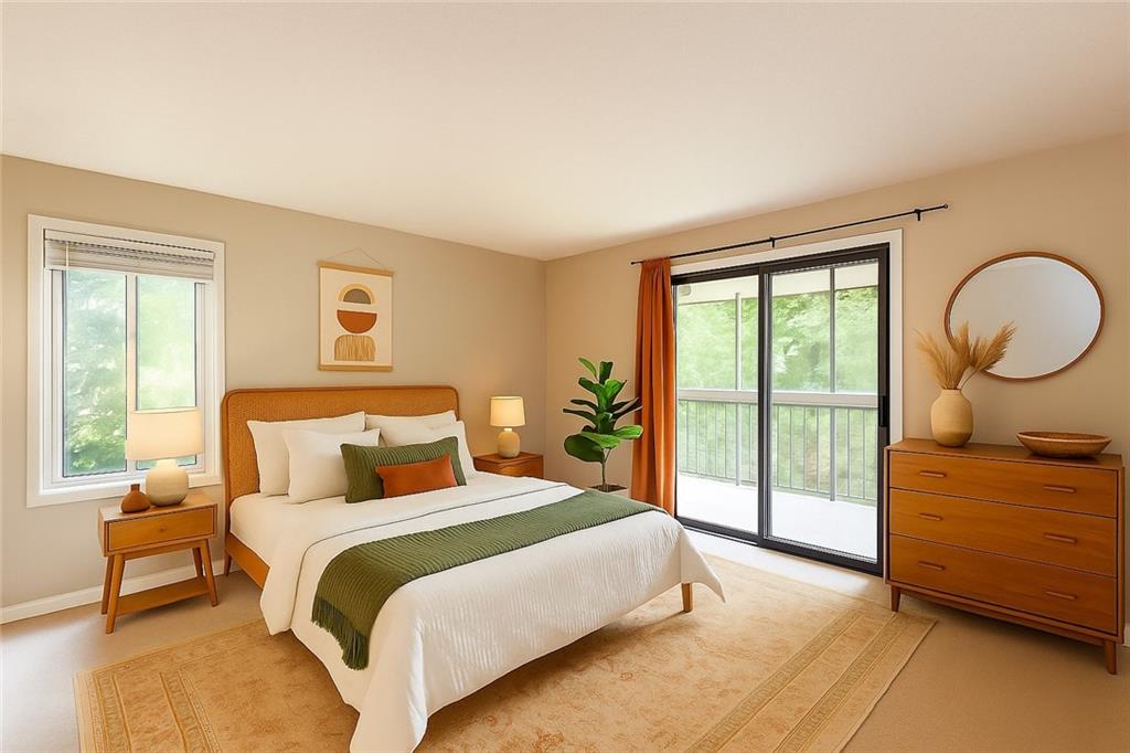 591 Emory Oaks Way, Unit 591 Decatur, GA 30033 - Photo 9 of 33 a bedroom with a bed a lamp and a large window with outer view