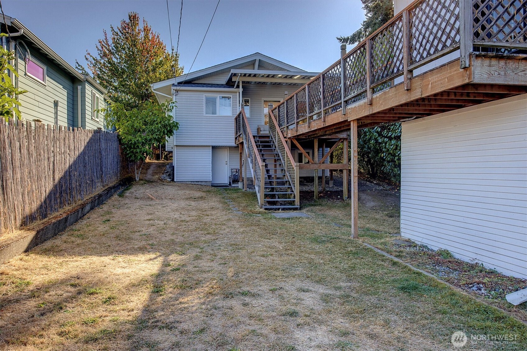 6021 45th Avenue Southwest Seattle, WA 98136 - Photo 13 of 18 a view of a house with a yard