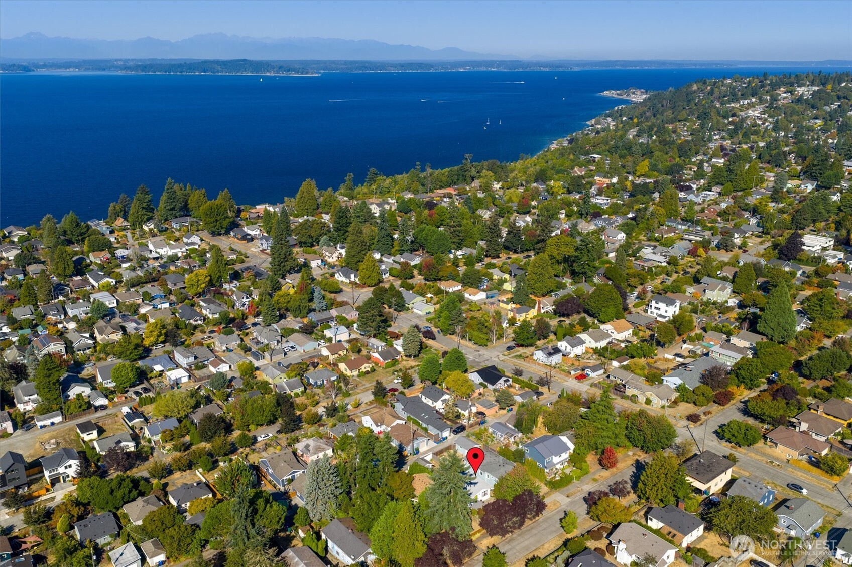 6021 45th Avenue Southwest Seattle, WA 98136 - Photo 16 of 18 a view of a large body of water with a building in the background