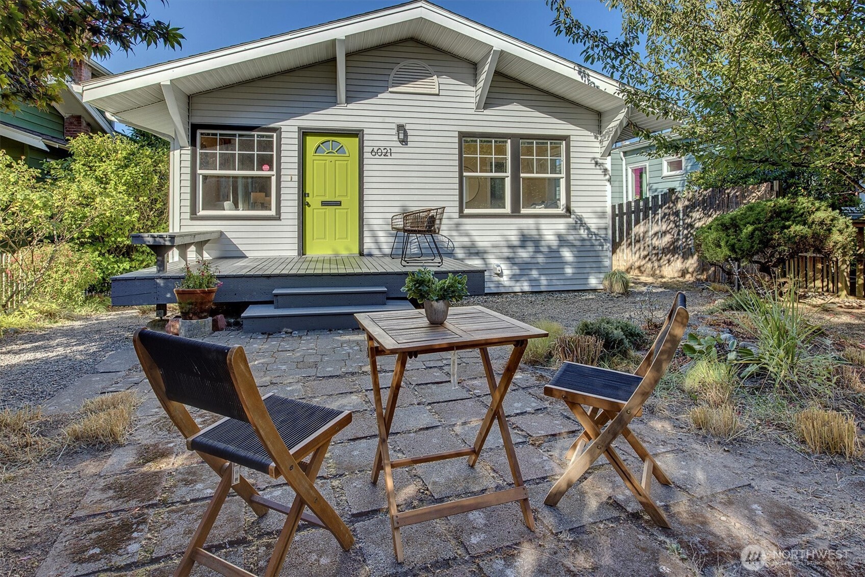 6021 45th Avenue Southwest Seattle, WA 98136 - Photo 18 of 18 a backyard of a house with table and chairs