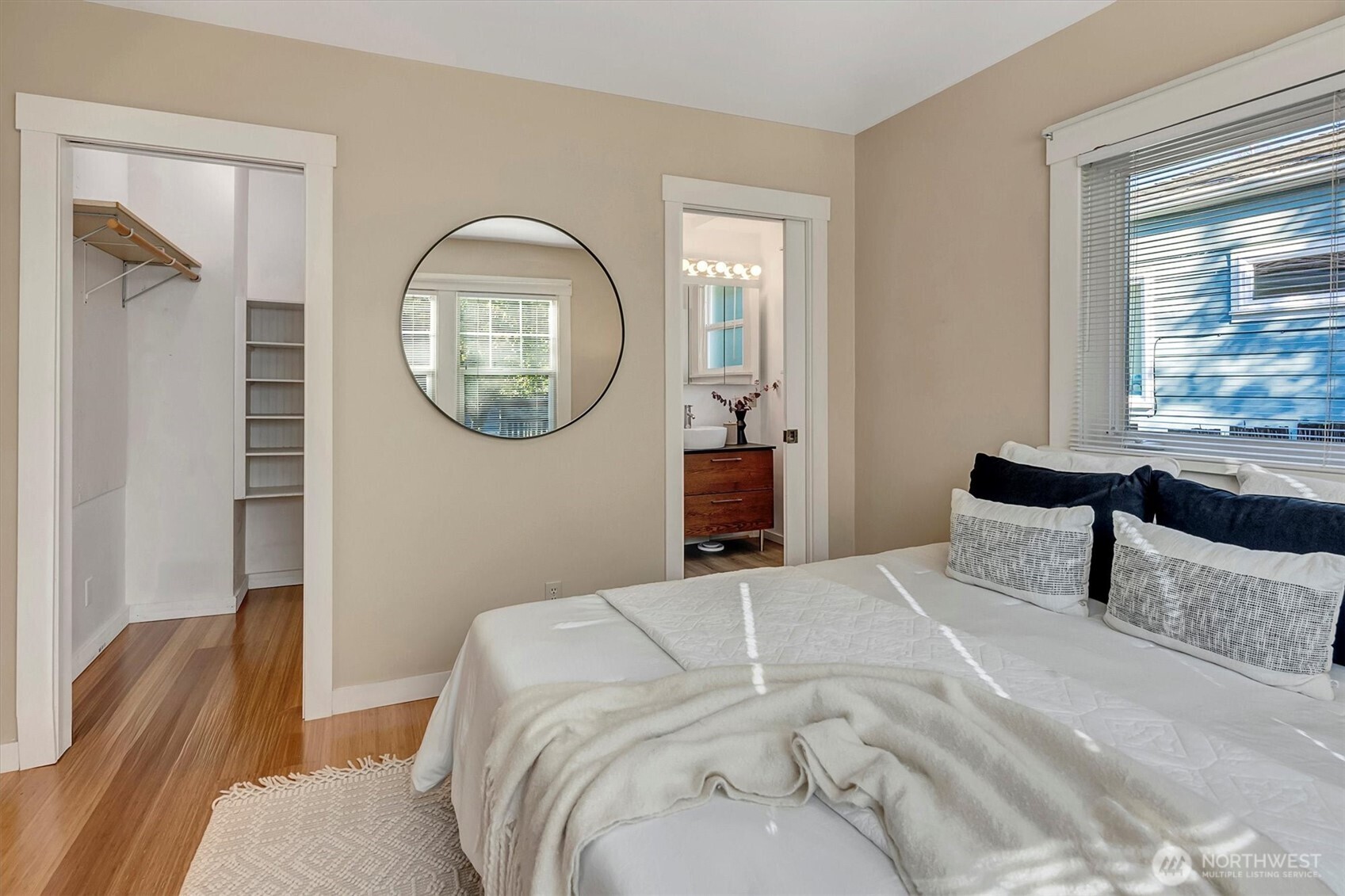 6021 45th Avenue Southwest Seattle, WA 98136 - Photo 7 of 18 a bedroom with a bed and a mirror